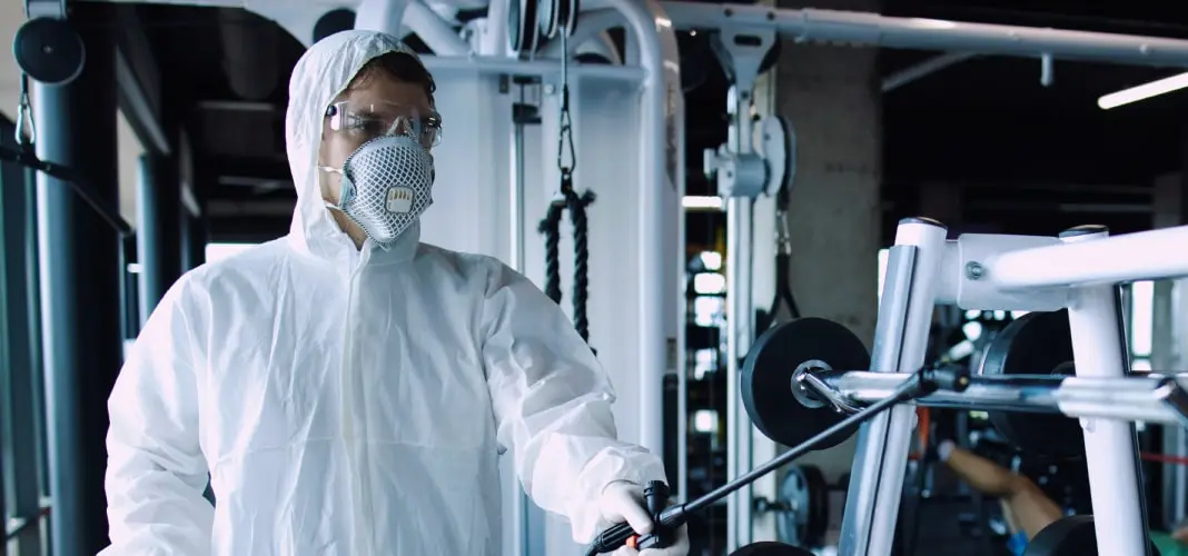 man-white-protection-suit-disinfecting
